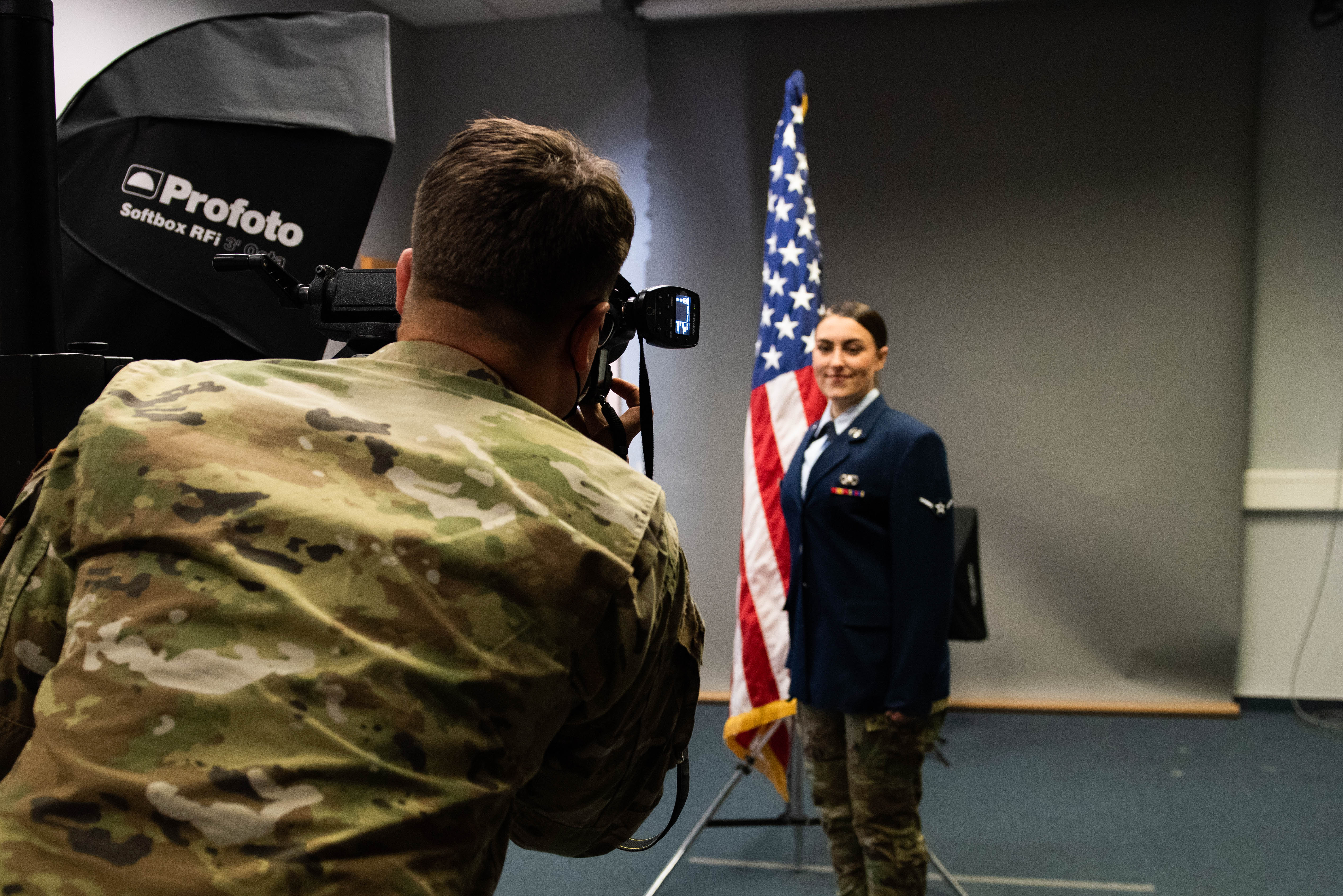 Professional headshot photographer: provides an array of photography services, from full-length portraits with plain backgrounds to official passport photo prints.